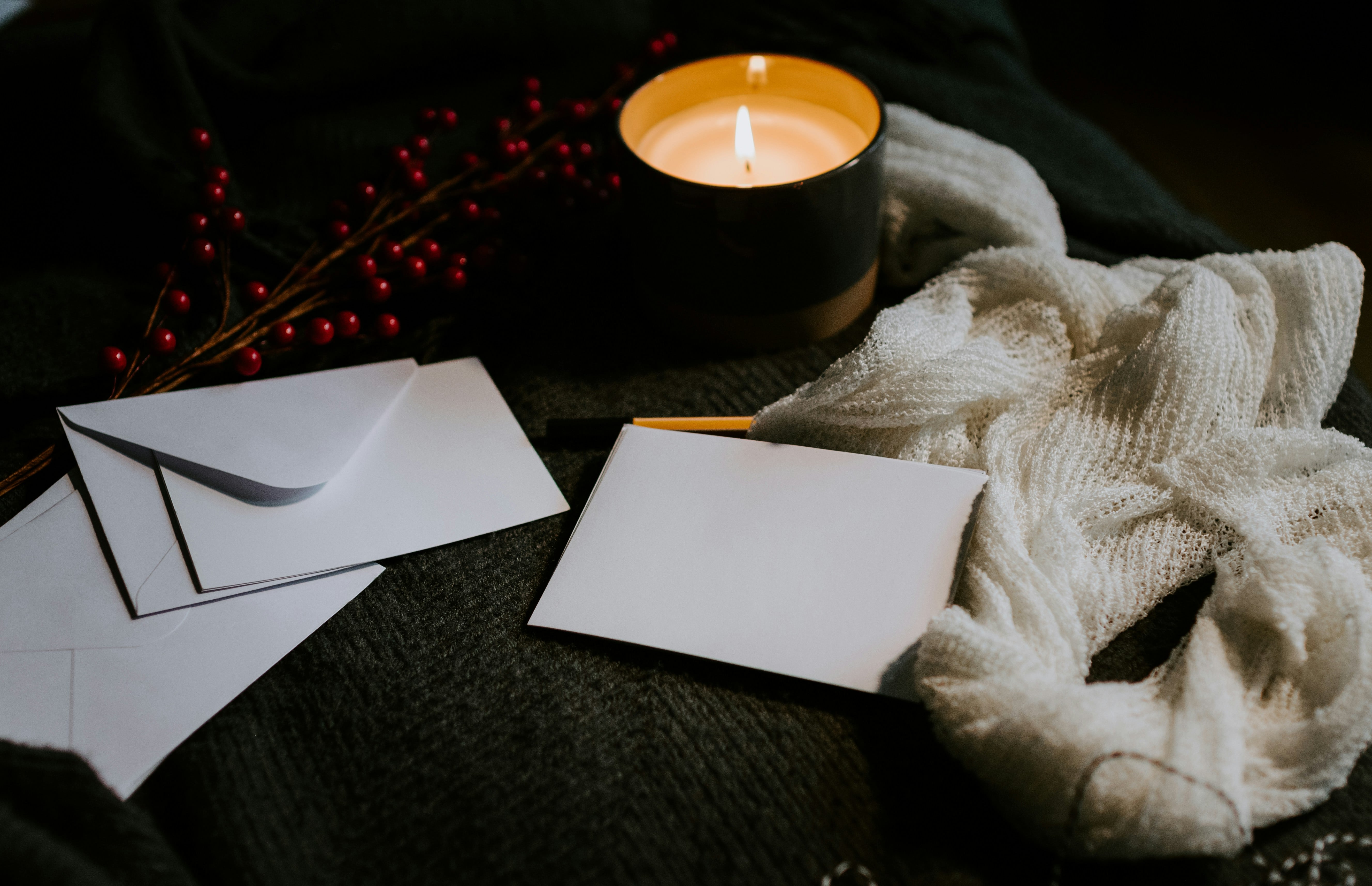 letters with candle in background