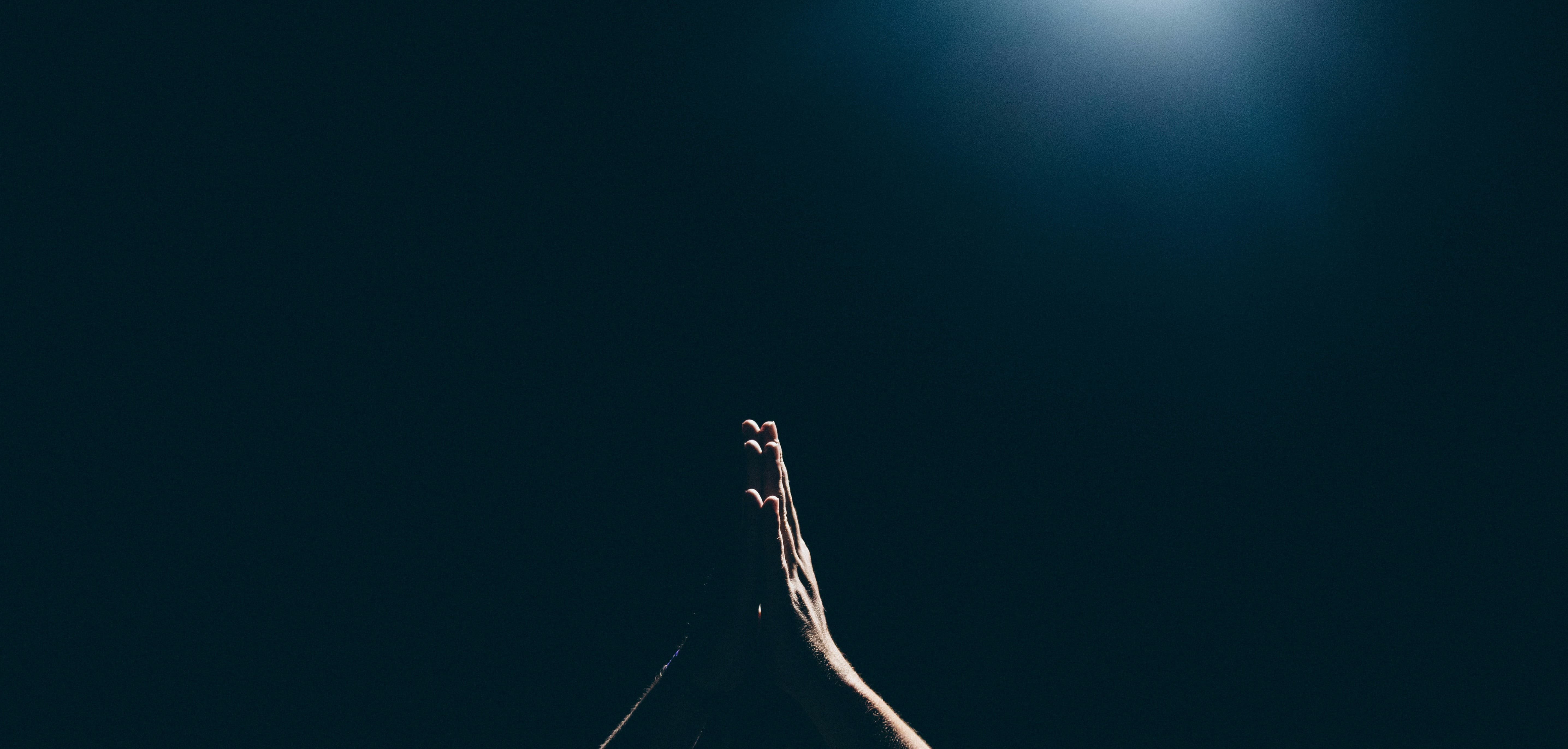 Two hands together in prayer